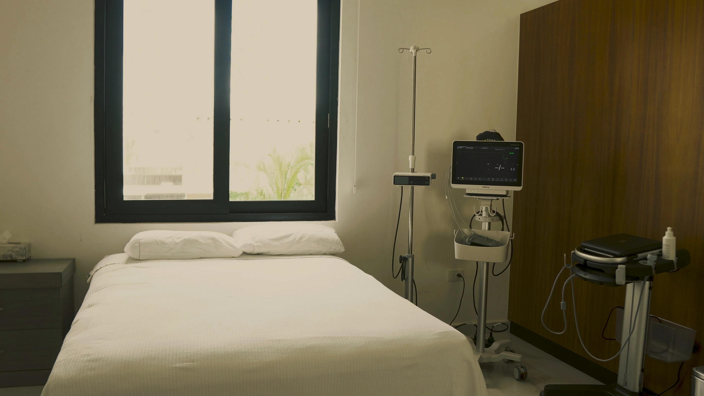 A treatment room at Transcend Clinic with bedside monitoring equipment